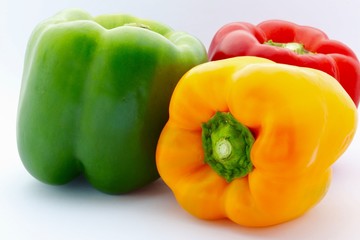Colorful Capsicums on White Background