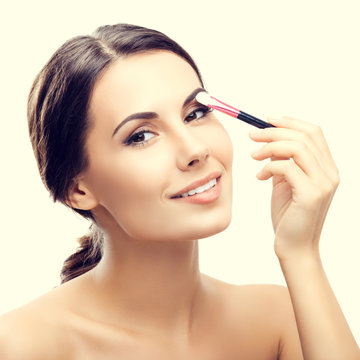 woman with cosmetics brush