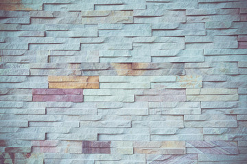 Stone wall texture background on vintage retro color tone