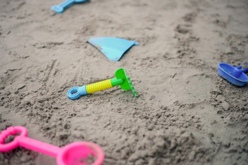 Colorful beach toys  on sand