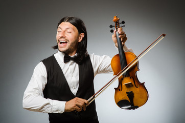 Man playing violin in musical concept