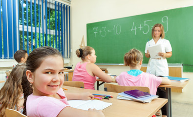 Elementary School Students at Classroom Desks