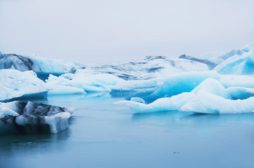 Beautiful blue icebergs in Jokulsarlon glacial lagoon, Iceland