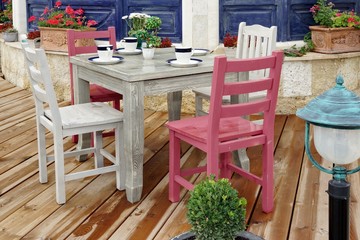 Vintage Wooden Dining Table And Chairs On Wood Patio Floor