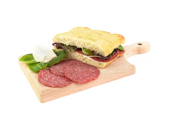 focaccia salami and gorgonzola on chopping board