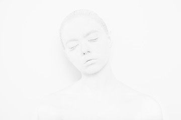 Girl with White Paint on the Skin on a White Background