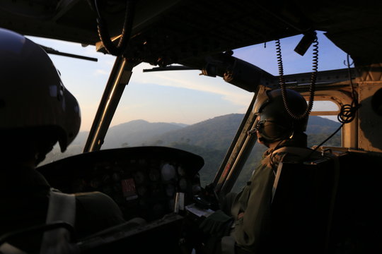 silhouette helicopter cockpit view  on sunrise