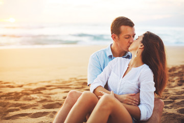 Romantic Couple Enjoying Beautiful Sunset at the Beach