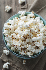 Popcorn and cola on the wooden table