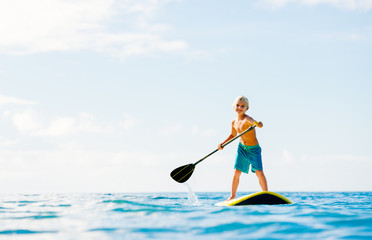  Young Boy Having Fun Stand Up Paddling