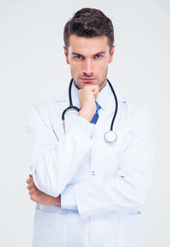 Portrait Of A Pensive Male Doctor Looking At Camera