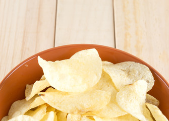 potato chips on wood background