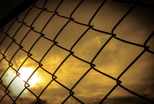 seamlessly tillable chain link fence with park in background