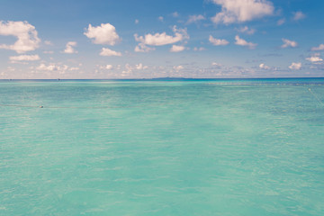 blue sky and water of ocean - vintage film filter
