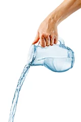 Crédence de cuisine en verre imprimé Eau Hand pouring water from glass jug