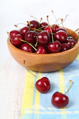 Ripe cherry in a wooden bowl