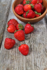 Ripe strawberry in a wooden bowl