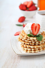 Waffles and ripe strawberries