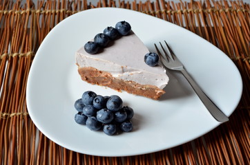 Yogurt cake with blueberries and biscuit base