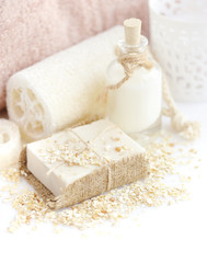 Handmade soap with oatmeal and milk on a white background