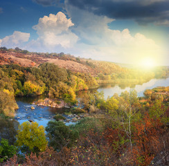 Obraz premium Valley of River in Autumn, beautiful sunny day, colorful trees