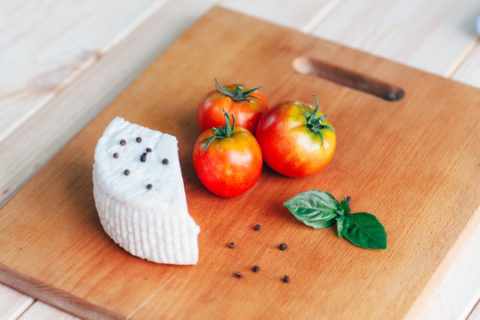 Culinary italian background. cheese, tomatoes, basil