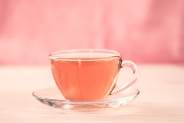 Cup of green tea on wooden background