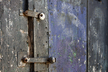 Padlocks on an old wooden door