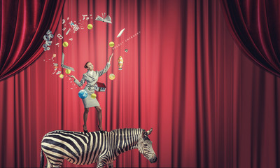 Businesswoman juggling with balls