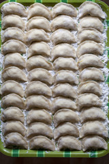 Cooking ukrainian varenyky with cherries
