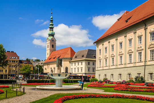 Woman refreshing herself at Kiki-Kogelnik-Brunnen in Klagenfurt 
