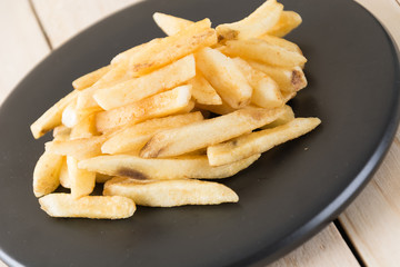 french fries on wood background