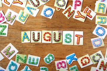 Colorful letters spelled as august