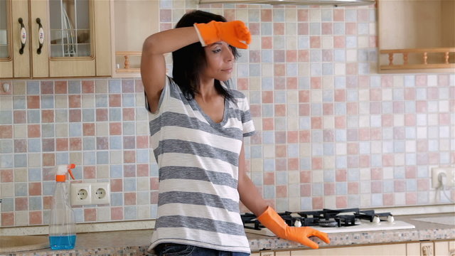 Tired housewife after cleanup