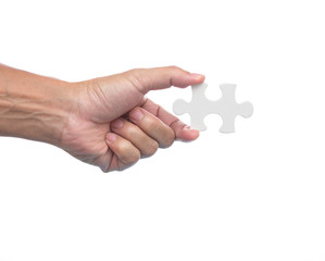 Man hand holding jigsaw puzzle on white background