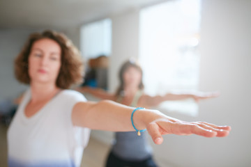 Women doing yoga workout in class