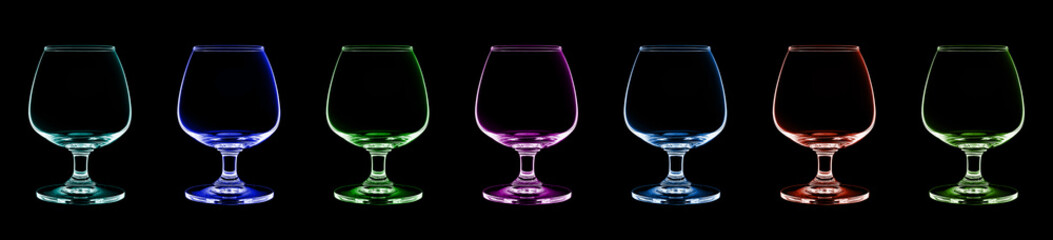 Empty brandy glass. Multiple color isolated on a black backgroun