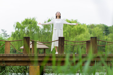 beautiful young girl in the reeds in the summer