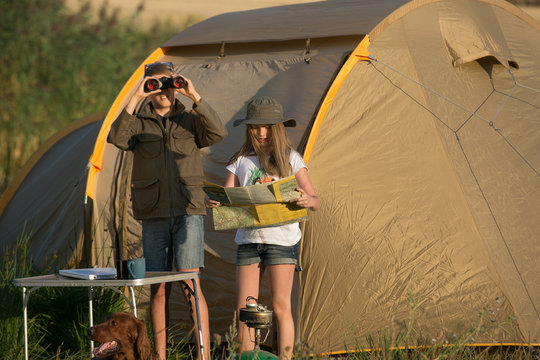 Boy and girl on a campsite, camping 