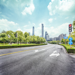 asphalt road and skyscrapers of modern city