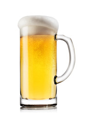 Light beer with the foam in mug