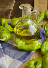 Still Life with olive oil and green peppers