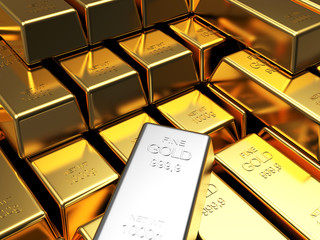 Stacks of golden bars with one of white gold. Business and financial background