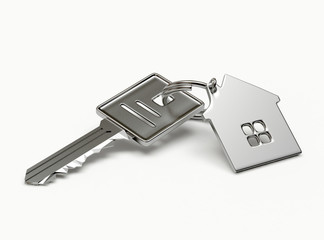 Mortgage concept. Silver key with house figure isolated on white background