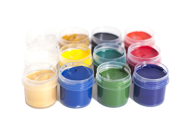 Open colorful cans of gouache paint