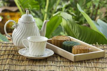 Moon cake on the tray Jug of tea