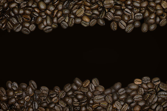 a border of coffee beans on a black background © tillottama