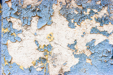 Old  stone wall  with cracked blue  color paint background