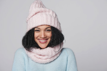 Laughing mixed race winter woman