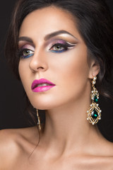 Beautiful brunette girl with arabic evening make-up and perfect